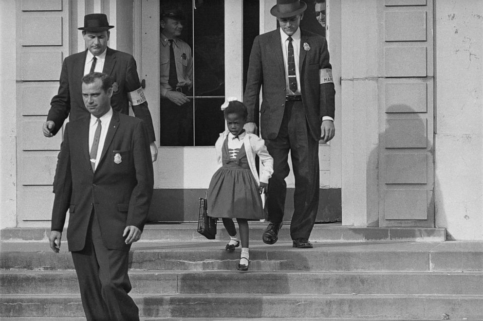 PHOTO: U.S. Deputy Marshals escort six-year-old Ruby Bridges from William Frantz Elementary School in New Orleans, Nov., 1960.  The first grader was the only Black child enrolled in the school at the time.