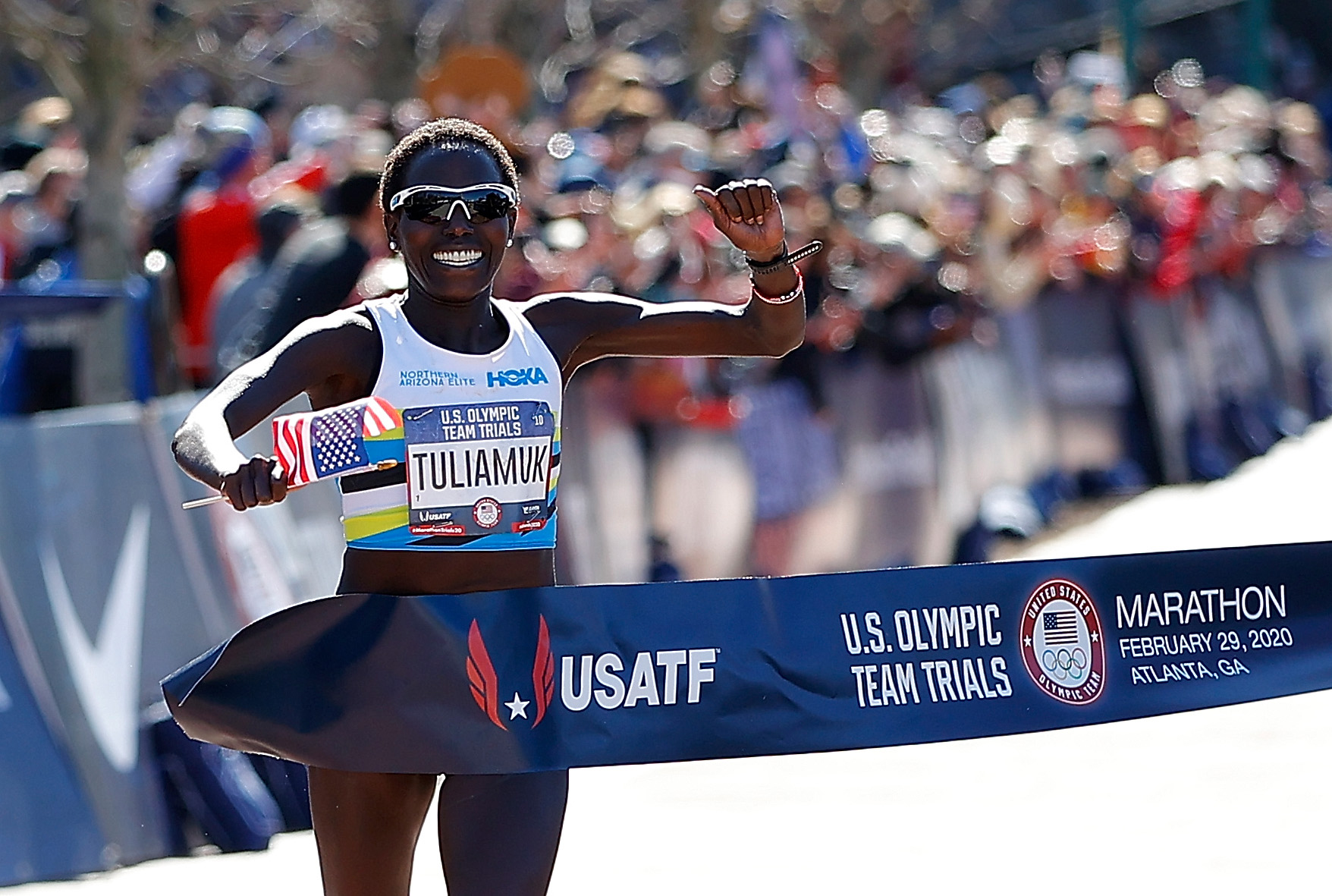 PHOTO: Aliphine Tuliamuk reacts as she crosses the finish line to win the Women's U.S. Olympic marathon team trials on Feb. 29, 2020 in Atlanta.