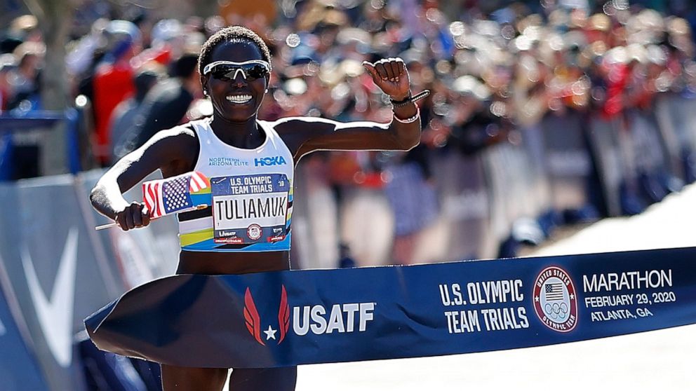 PHOTO: Aliphine Tuliamuk reacts as she crosses the finish line to win the Women's U.S. Olympic marathon team trials on Feb. 29, 2020 in Atlanta.