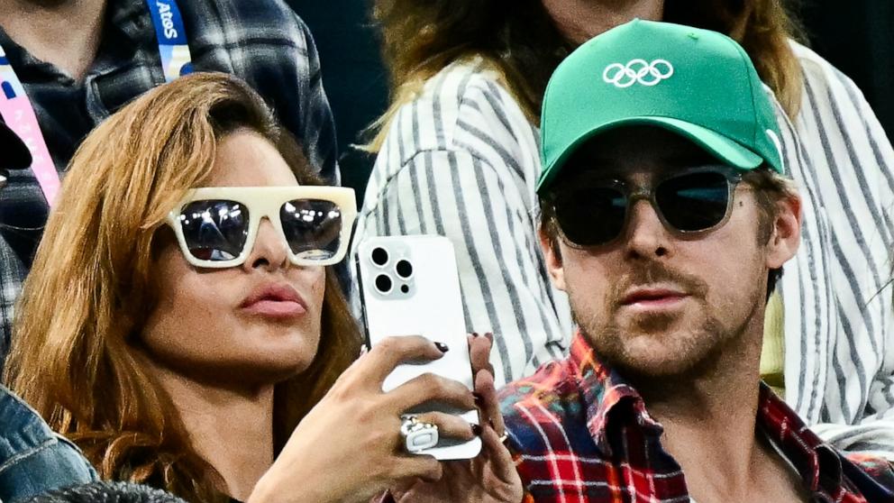 PHOTO: US actress Eva Mendes (L) and her partner Canadian actor Ryan Gosling (R) attend the artistic gymnastics women's uneven bars final during the Paris 2024 Olympic Games at the Bercy Arena in Paris, on Aug. 4, 2024. 