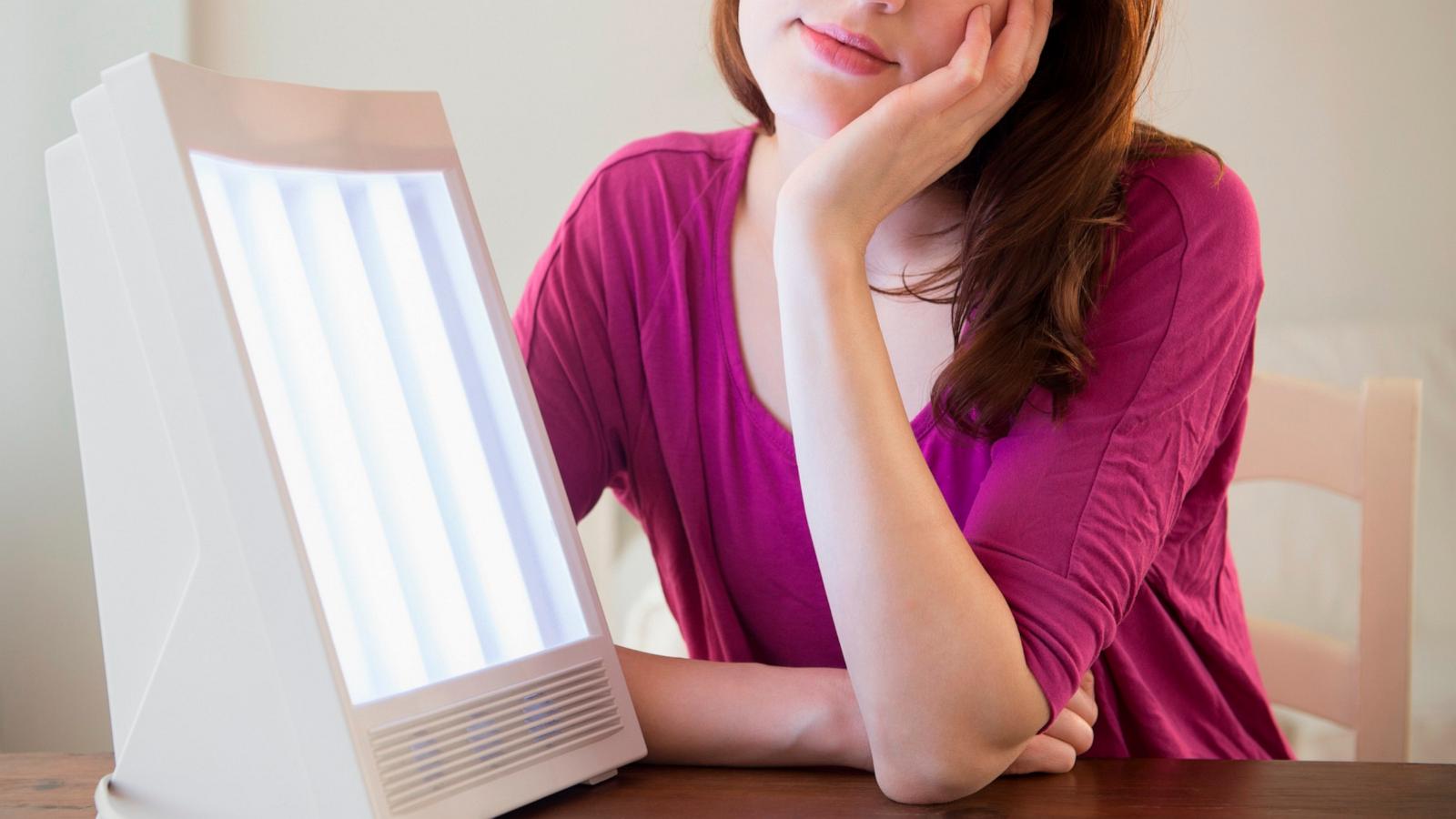 PHOTO: A woman uses light therapy in an undated stock photo.