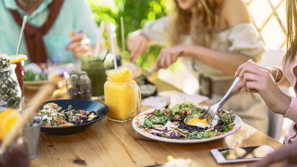 PHOTO: People eat salads at a restaurant in an undated stock photo. 