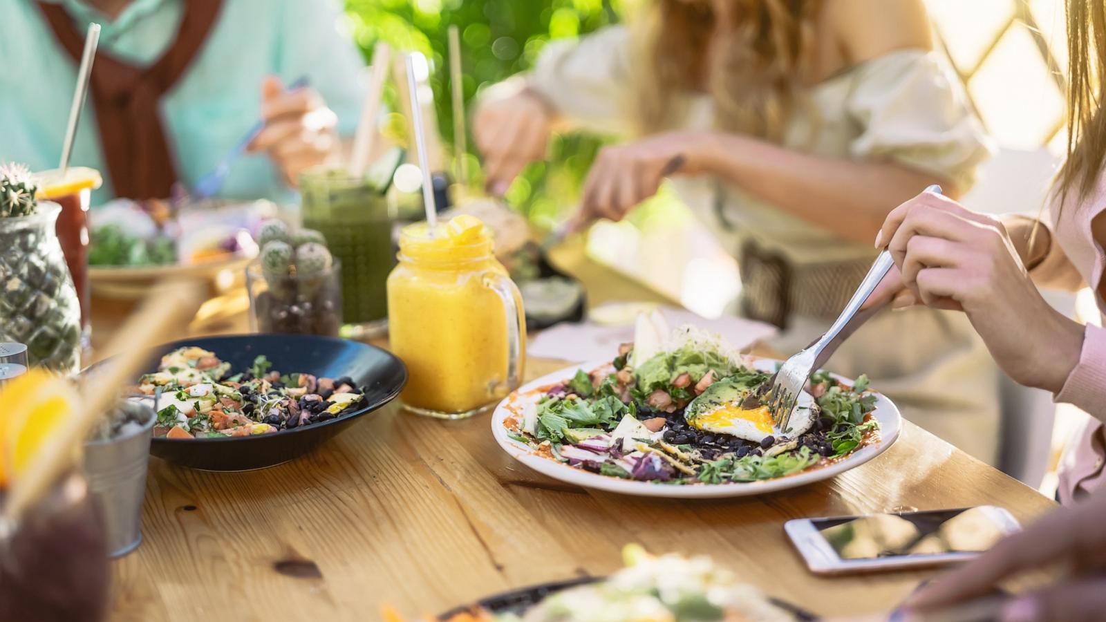 PHOTO: People eat salads at a restaurant in an undated stock photo.