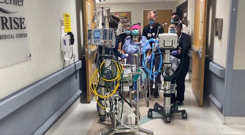 PHOTO: Rowena Salas, 32, takes her first steps after being hospitalized with COVID-19 at Sunrise Hospital in Las Vegas.