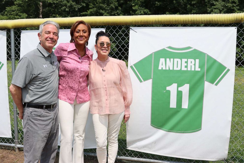 Attorney Mark Anderl and wife, Judge Esther Salas, pose for a picture with "GMA's" Robin Roberts. 
