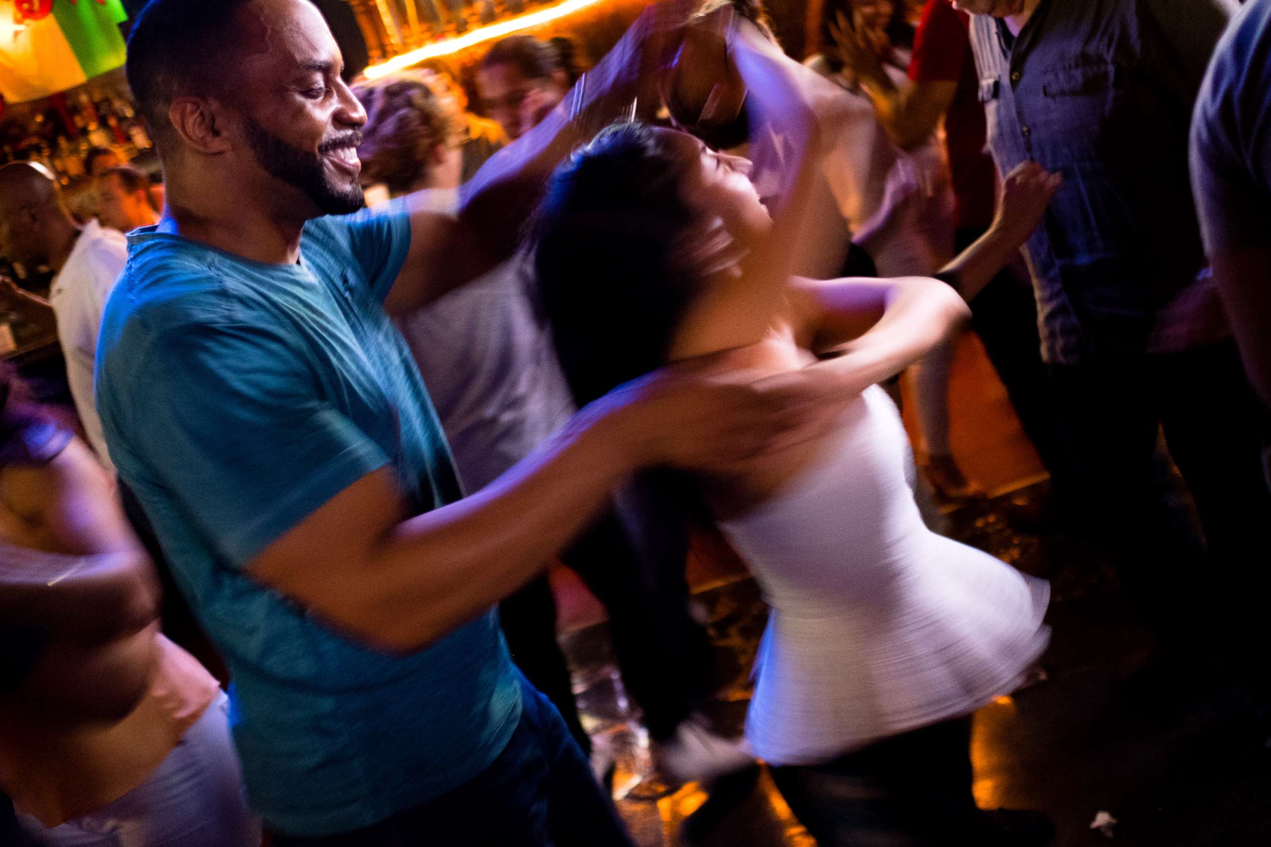PHOTO: Pierre Bennett spins Joanna Mendez on the dance floor of The Lucky Bar on salsa night at the bar, on Aug. 7, 2017 in Washington, D.C.