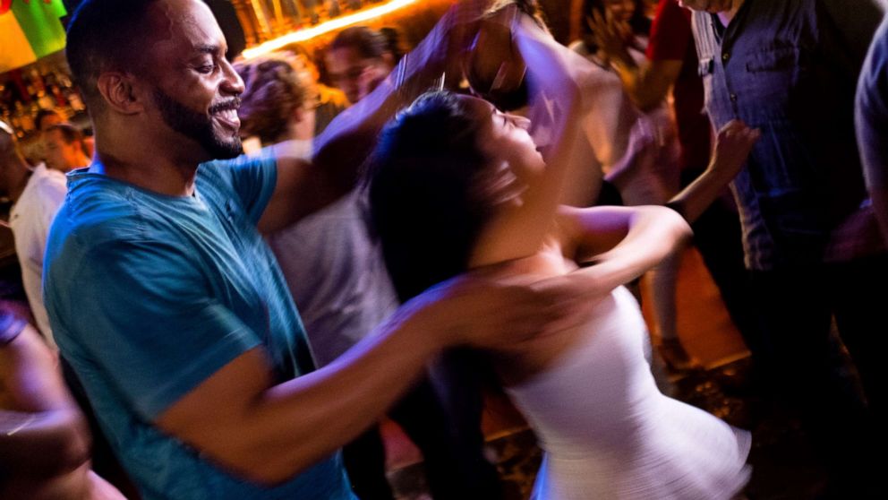 PHOTO: Pierre Bennett spins Joanna Mendez on the dance floor of The Lucky Bar on salsa night at the bar, on Aug. 7, 2017 in Washington, D.C.