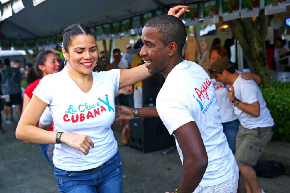 PHOTO: La Clave Cubana dancers perform a salsa routine at the annual Cinco de Mayo block party on March 5, 2016 in the Green Lake suburg of Seattle.