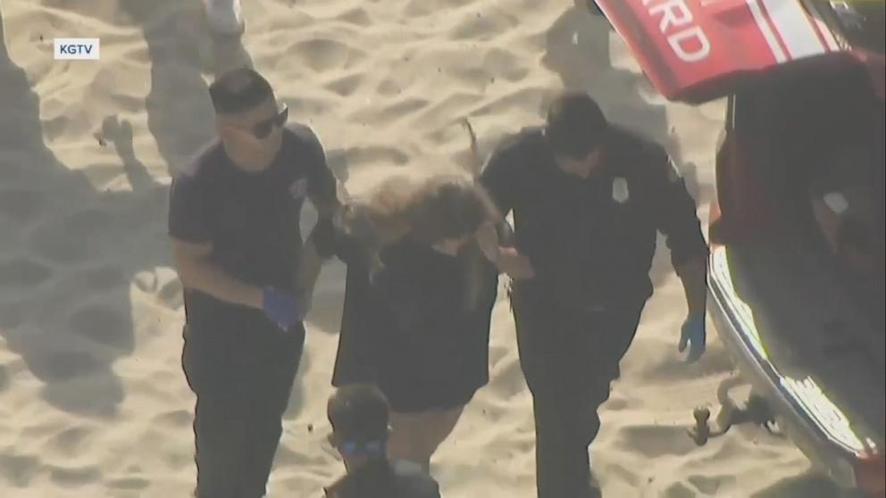 PHOTO: A 16-year-old girl is rescued after being trapped beneath the sand at Mission Beach, July 16, 2024, in San Diego.