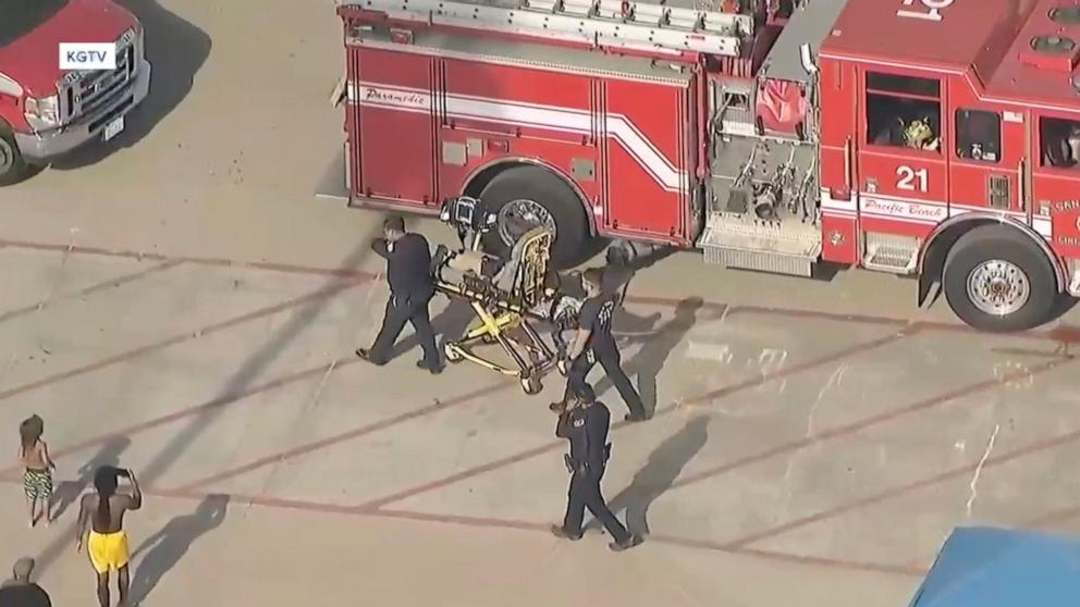 PHOTO: A 16-year-old girl is rescued after being trapped beneath the sand at Mission Beach, July 16, 2024, in San Diego.