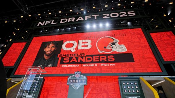 A screen shows Colorado quarterback Shedeur Sanders after being chosen by the Cleveland Browns with the 144th overall pick during the third day of the NFL football draft, on April 26, 2025, in Green Bay, Wis.