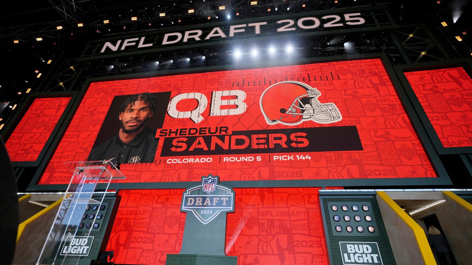 PHOTO: A screen shows Colorado quarterback Shedeur Sanders after being chosen by the Cleveland Browns with the 144th overall pick during the third day of the NFL football draft, on April 26, 2025, in Green Bay, Wis.