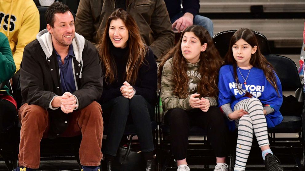 PHOTO: Adam Sandler, Jackie Sandler, Sadie Sandler and Sunny Sandler attend a game at Madison Square Garden, Dec. 25, 2018 in New York City.