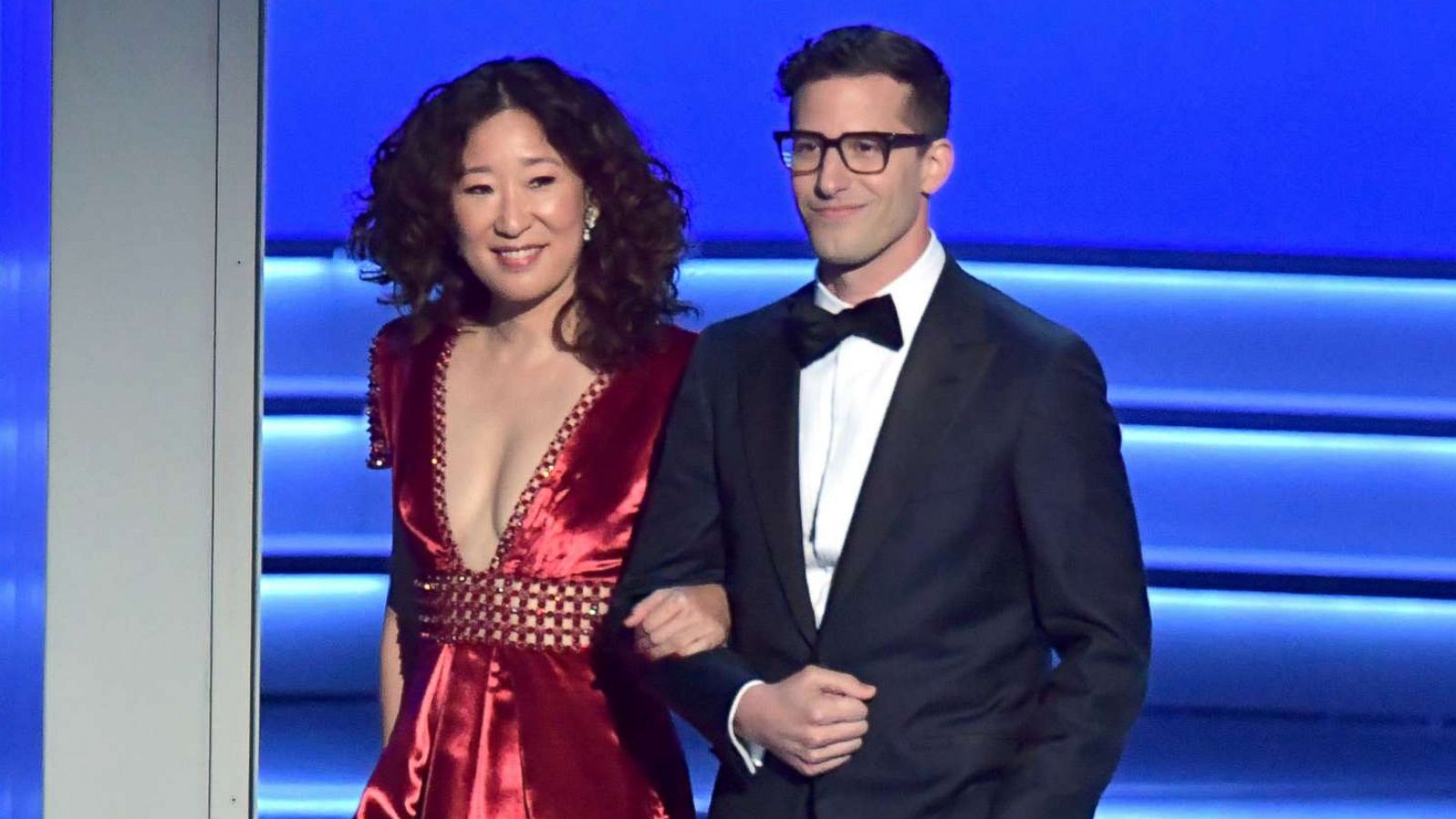PHOTO: Sandra Oh and Andy Samberg walk onstage during the 70th Emmy Awards at Microsoft Theater, Sept. 17, 2018, in Los Angeles.