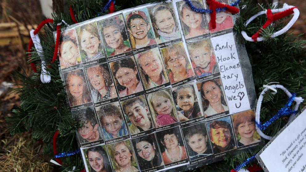 PHOTO: Photos of Sandy Hook Elementary School massacre victims sits at a small memorial near the school on Jan. 14, 2013 in Newtown, Conn.