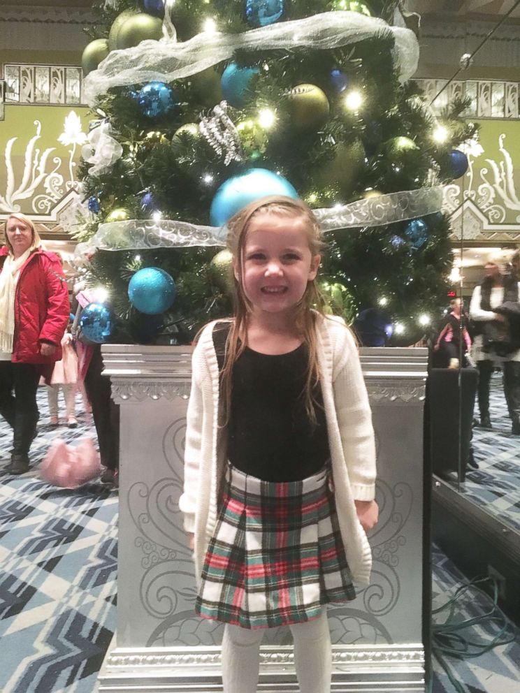 PHOTO: Ellie Mae Oberst in front of a tree.