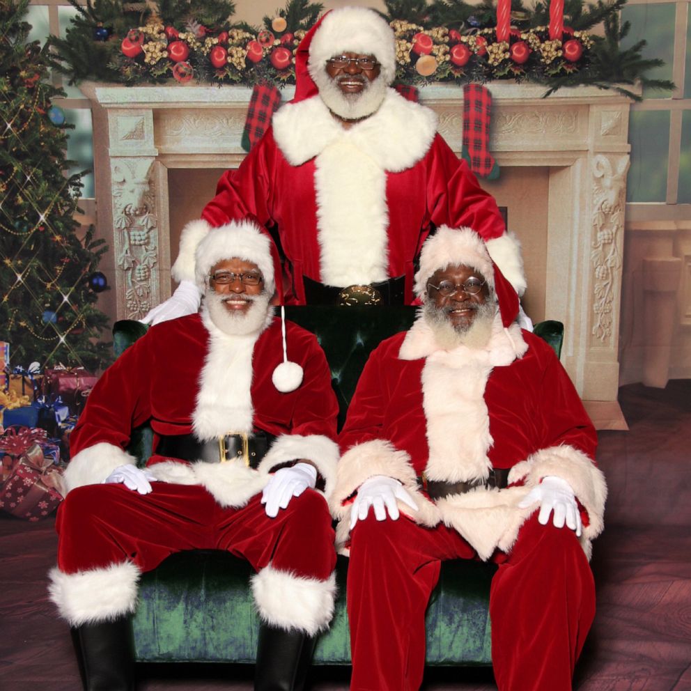 PHOTO: Stafford Braxton's team of Santas pose for holiday picture at a pop-up Christmas event.