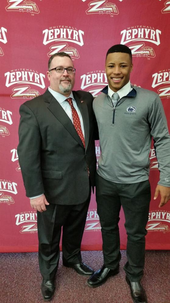 PHOTO: Philadelphia Eagles running back Saquon Barkley is pictured with Bob Hartman (left), the athletic director at Whitehall High School, Barkley’s alma mater.