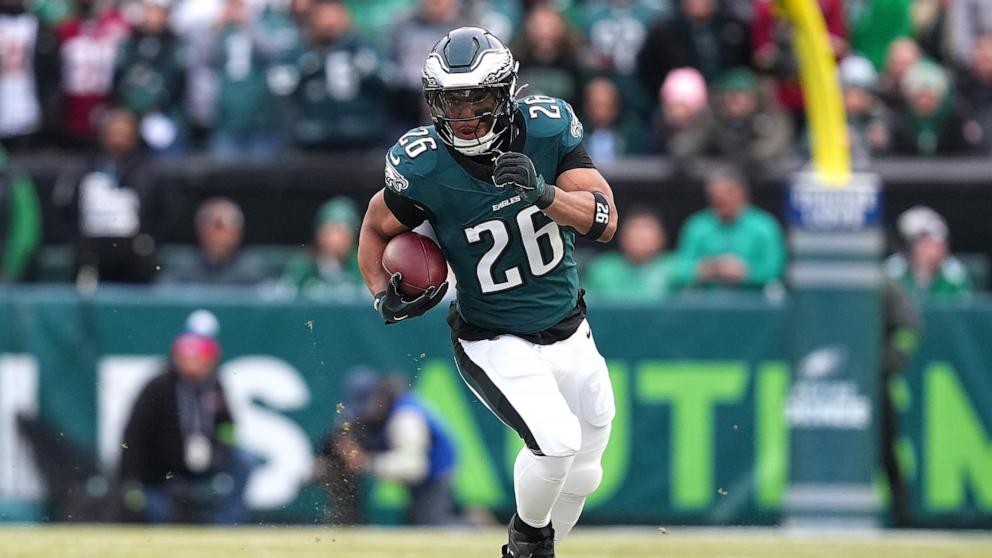 PHOTO: Saquon Barkley #26 of the Philadelphia Eagles runs the ball to score a 60 yard touchdown against the Washington Commanders during the first quarter in the NFC Championship Game at Lincoln Financial Field, Jan. 26, 2025, in Philadelphia.