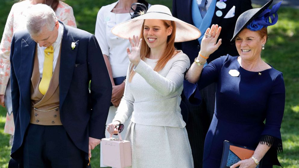 PHOTO: Prince Andrew, Duke of York bows his head whilst Princess Beatrice and Sarah, Duchess of York wave to Queen Elizabeth II as she and her guests pass by in horse drawn carriages, June 22, 2018 in Ascot, England.