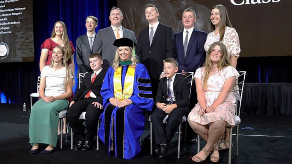 PHOTO: Dr. Sarah Merrill poses with her family at the Mayo Clinic Alix School of Medicine graduation on May 20, 2022.