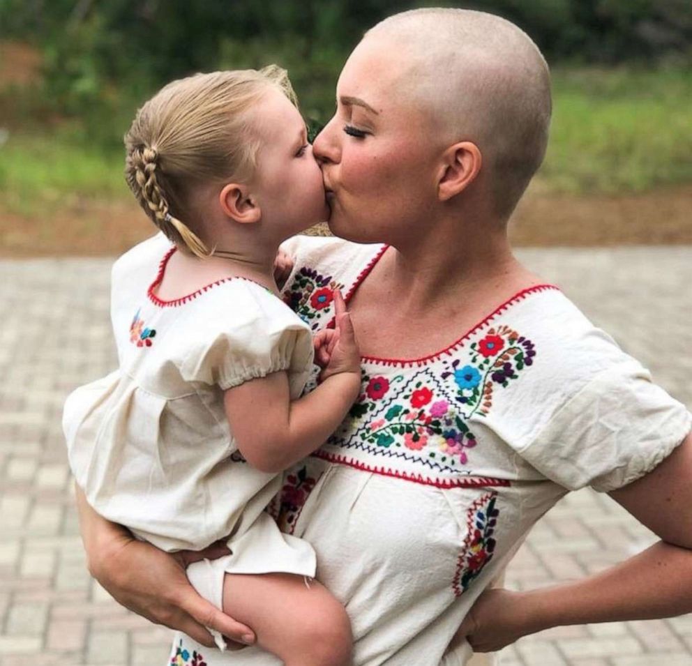 PHOTO: Sarah Sharpe holds her daughter Charlotte, 4, in a photo taken while she underwent chemotherapy treatments.