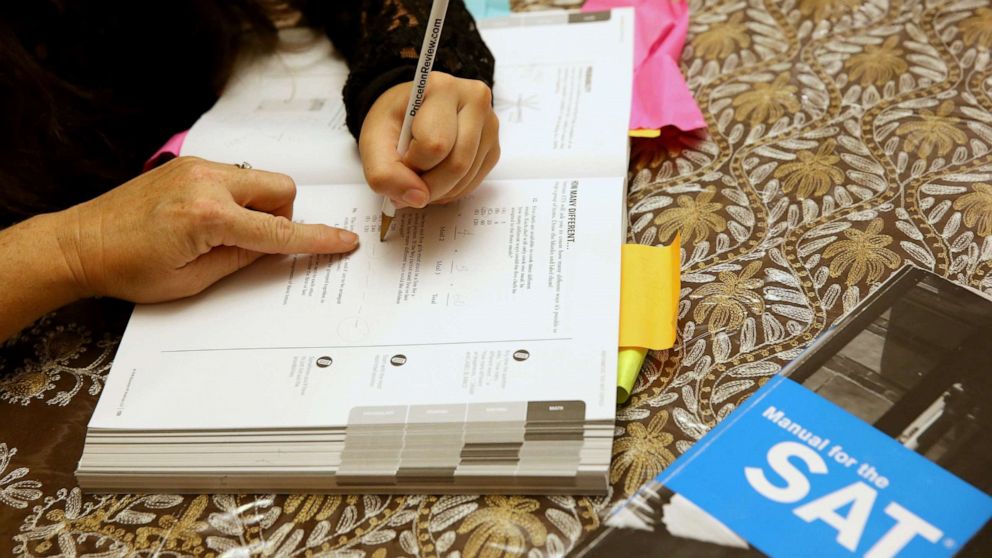 PHOTO: In this March 6, 2014, file photo, a tutor goes over SAT test preparation with an 11th grader in Pembroke Pines, Fla.