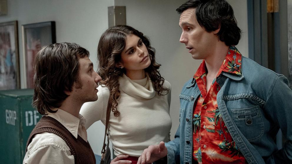 PHOTO: This image released by Sony Pictures shows Gabriel LaBelle as Lorne Michaels, left, Kaia Gerber as Jacqueline Carlin, center, and Cory Michael Smith as Chevy Chase in a scene from "Saturday Night." 