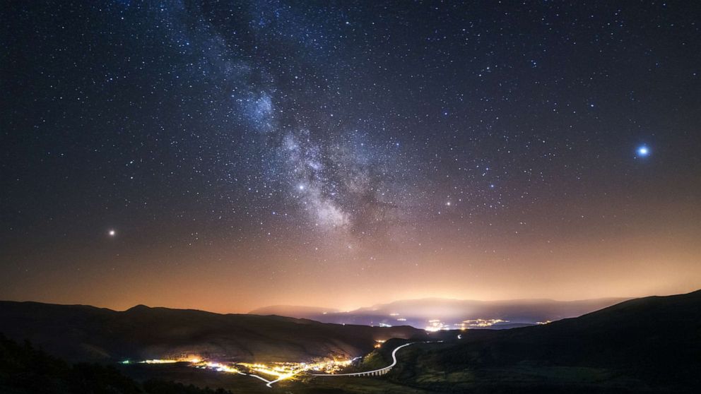 PHOTO: This undated file photo shows the town of Assergi, Italy. The bright reddish star at left is Mars, Saturn is at the middle of the image, and the bright star on the right is Jupiter.