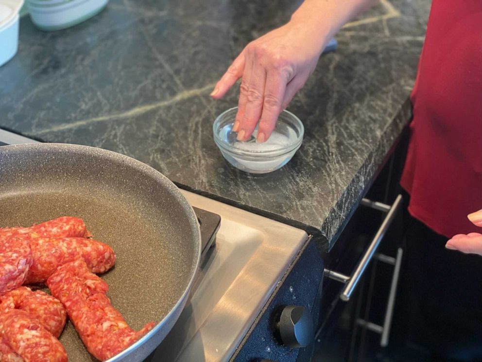 PHOTO: Use ice water to stop sausage from sticking to fingers while crumbling it from the casing.