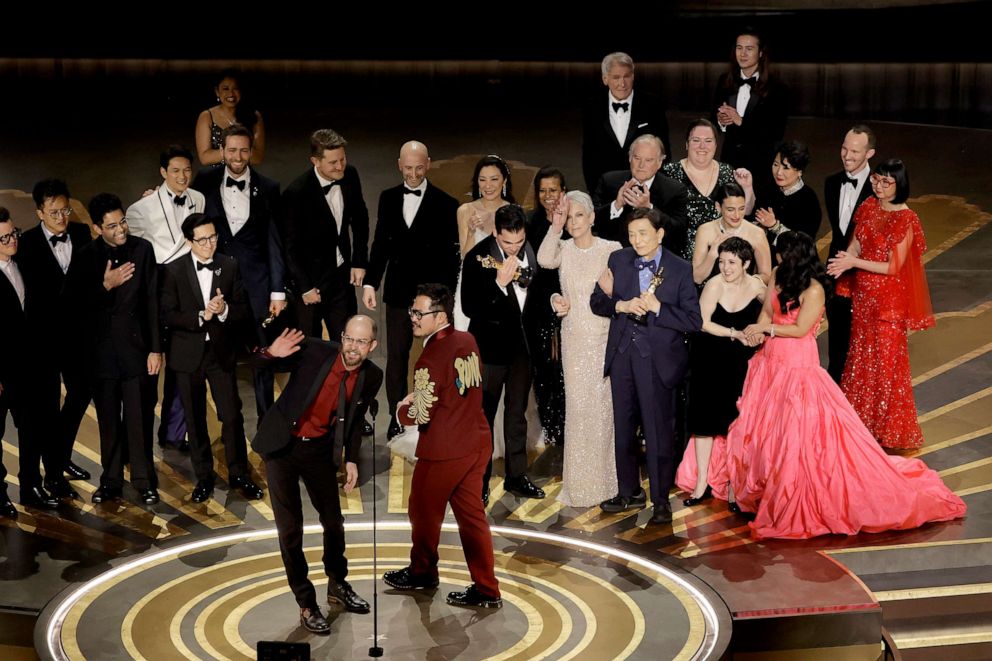 PHOTO: Daniel Scheinert and Daniel Kwan accept the Best Picture Oscar for "Everything Everywhere All at Once" along with cast and crew onstage during the 95th Annual Academy Awards, March 12, 2023, in Hollywood, Calif.