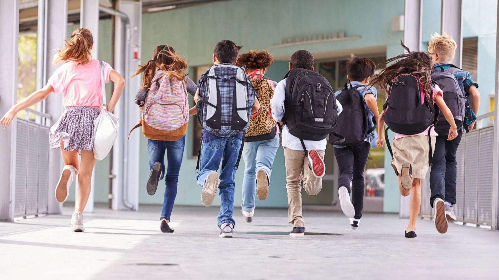 PHOTO: A group of elementary school kids run towards school in an undated stock photo.