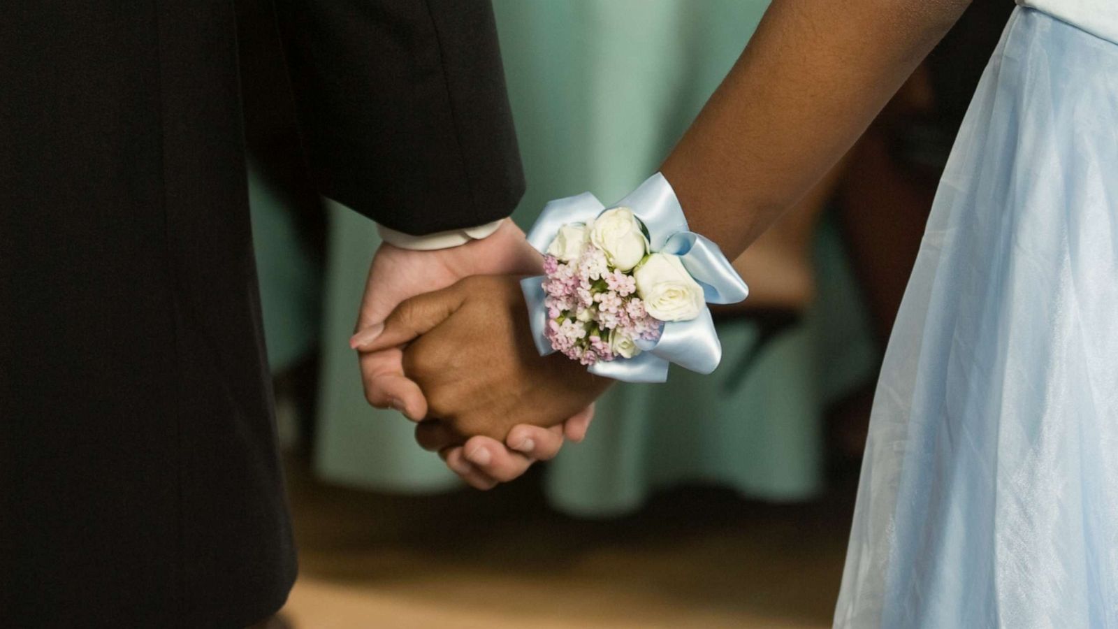 PHOTO: A young couple hold hands a dance in this stock photo.