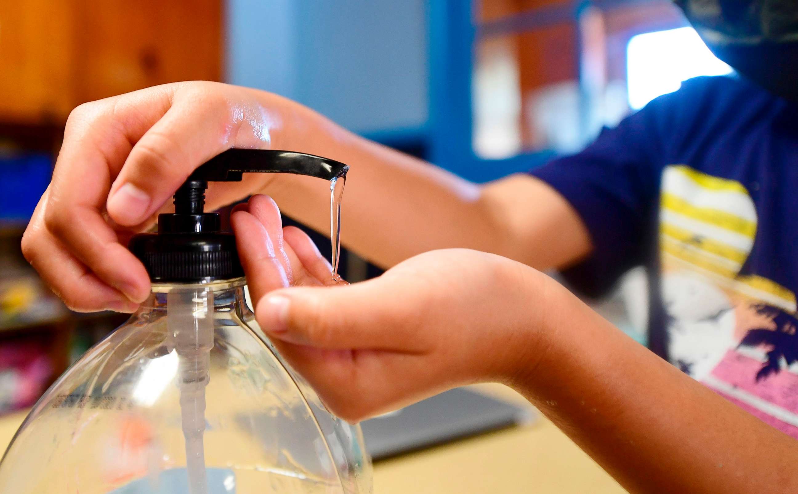 PHOTO: Hand sanitizer is used by students as per coronavirus guidelines, during summer school sessions at Happy Day School in Monterey Park, Calif.,  July 9, 2020.