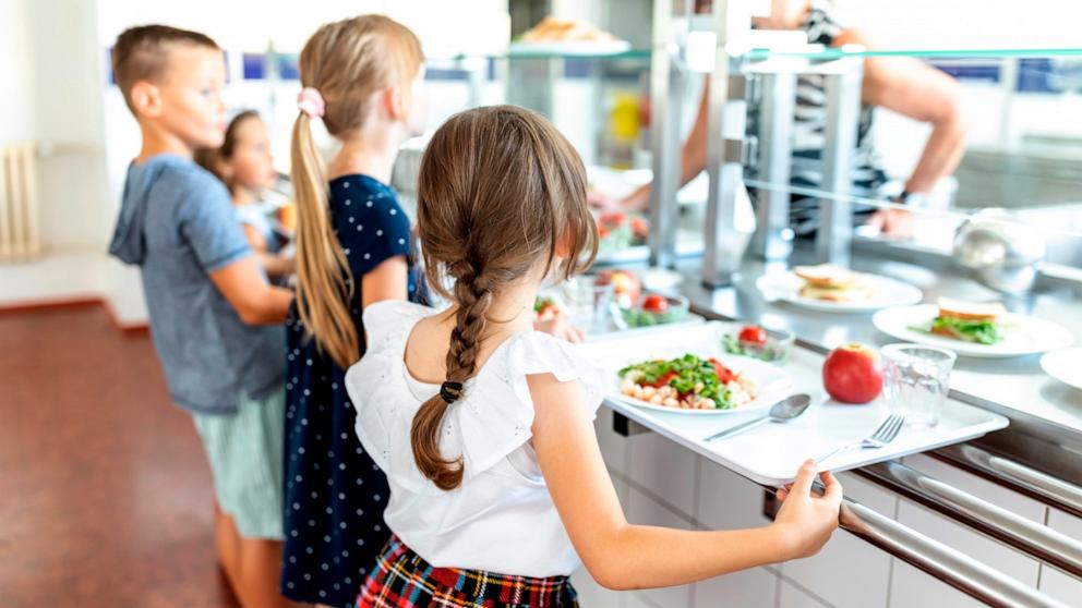 PHOTO: Stock photo of students waiting in a lunch line.