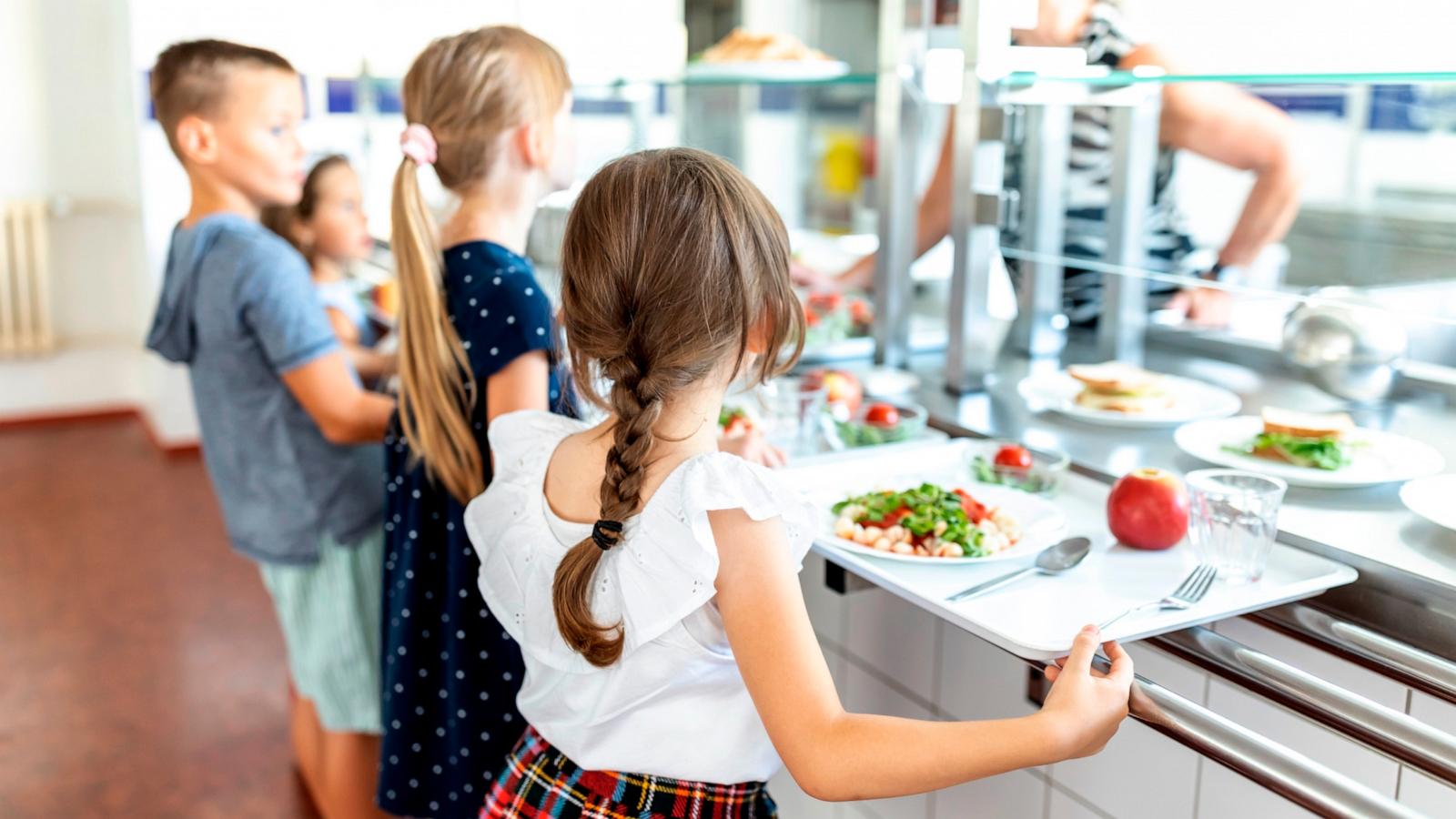PHOTO: Stock photo of students waiting in a lunch line.