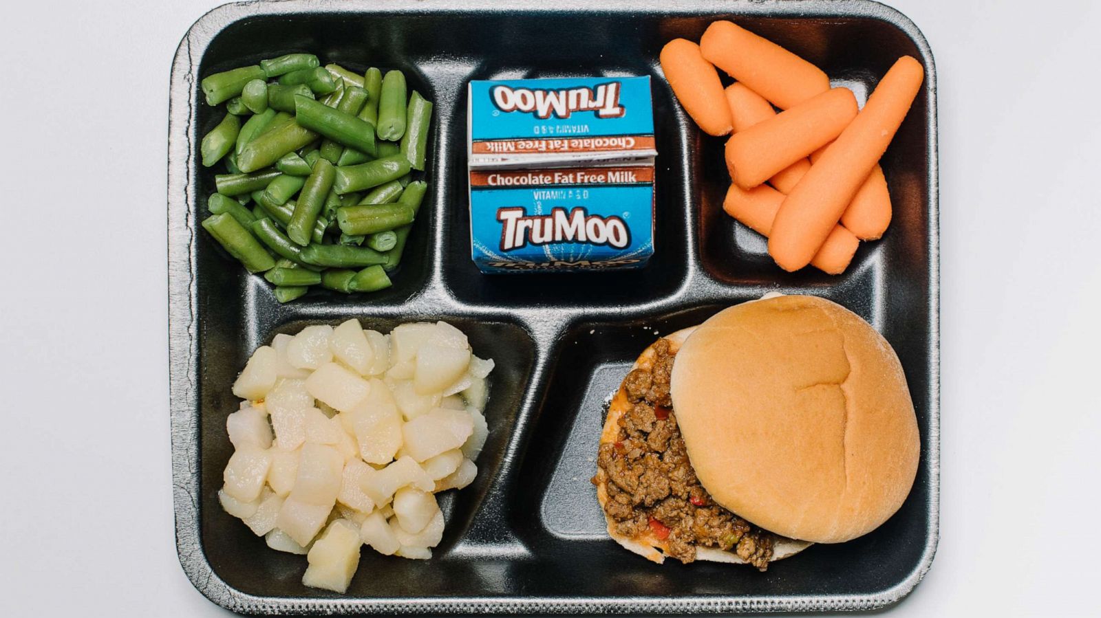 PHOTO: In this Oct. 2, 2019, file photo, a lunch tray for kids at Twain Elementary in Littleton, Co., contains a Sloppy Joe, green beans, carrots, chocolate milk, and fruit.