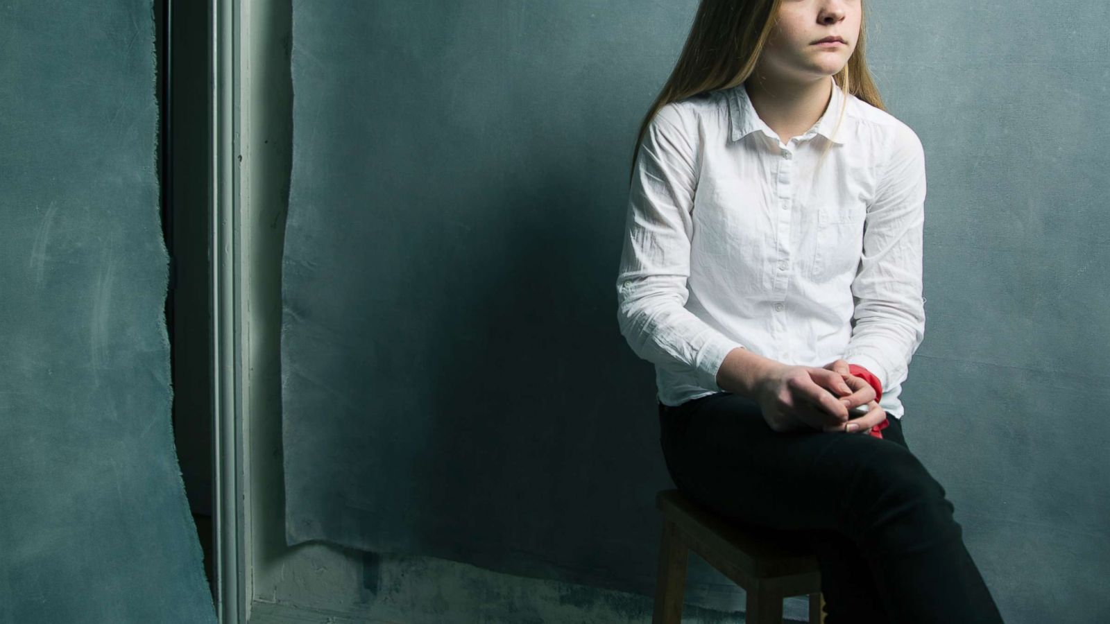 PHOTO: A girl sits in front of a canvas in an undated stock photo.