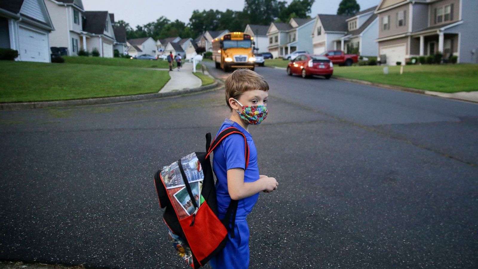 PHOTO: Paul Adams, 7, waits at the bus stop for the first day of school, Aug. 3, 2020, in Dallas, Ga.