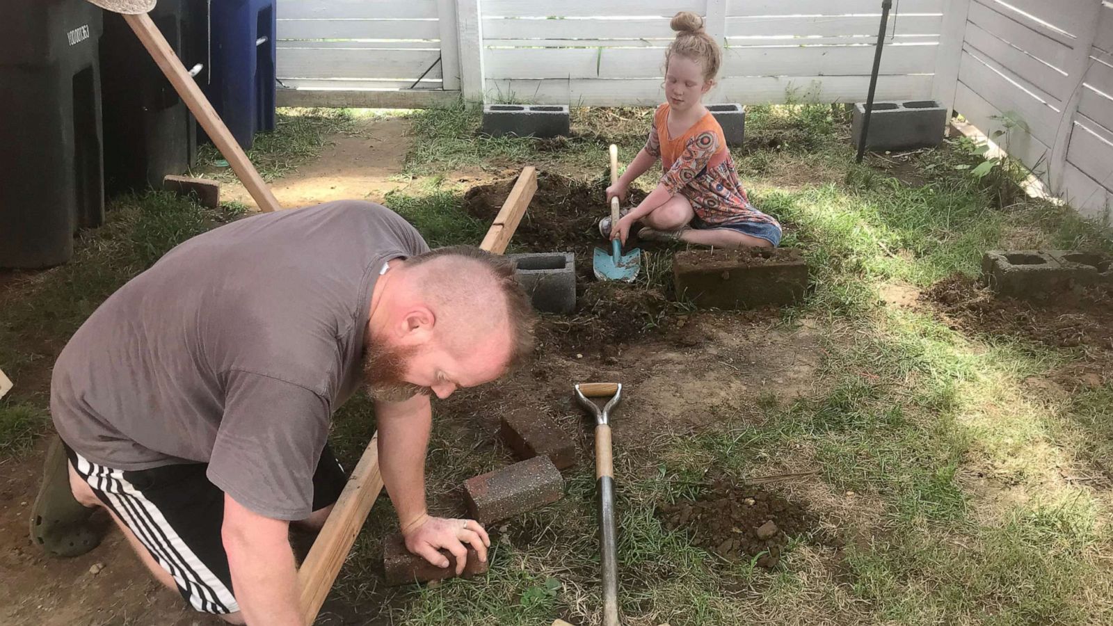 PHOTO: Ixel helps her dad build her "rainbow" schoolhouse. John "Mac" McIntire and his wife, Ixi Blandon, built a "rainbow" schoolhouse in their backyard for their 8-year-old daughter, Ixel.