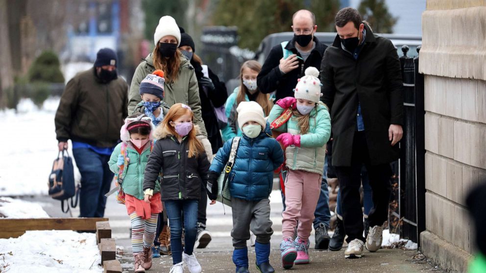 PHOTO: Students walk to elementary school in Chicago, Jan. 12, 2022.