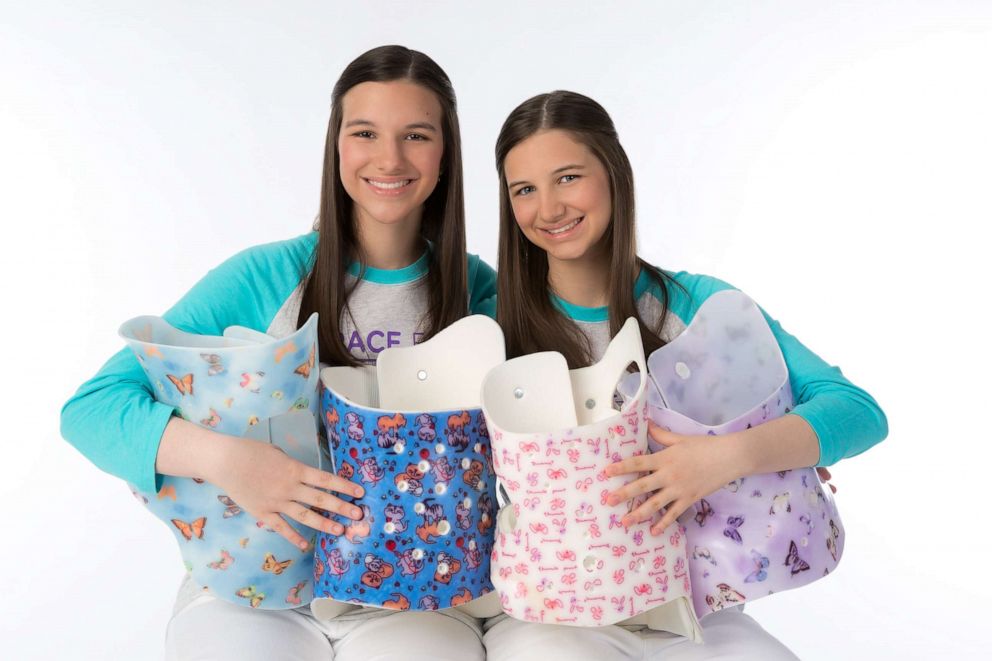 PHOTO: Delaney and Hadley Robertson, 15, created the BraceTrack app to help people who use scoliosis braces.
