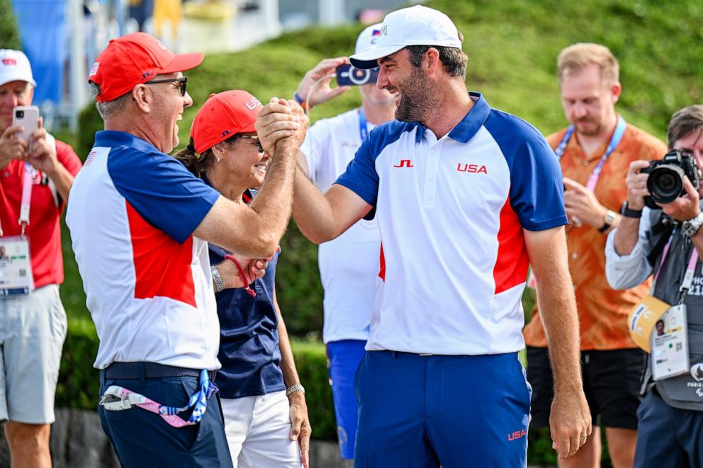 PHOTO: In this Aug. 4, 2024, file photo, Scottie Scheffler of Team USA celebrates with his dad Scott Scheffler after winning the gold medal during the final round of the Olympic men's golf competition at the Olympic Games Paris 2024.