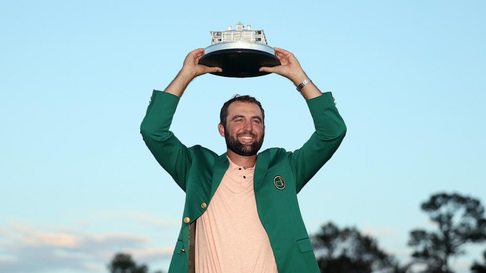 PHOTO: In this April 14, 2024, file photo, Scottie Scheffler of the United States poses with the Masters trophy after winning the 2024 Masters Tournament at Augusta National Golf Club in Augusta, Georgia. 