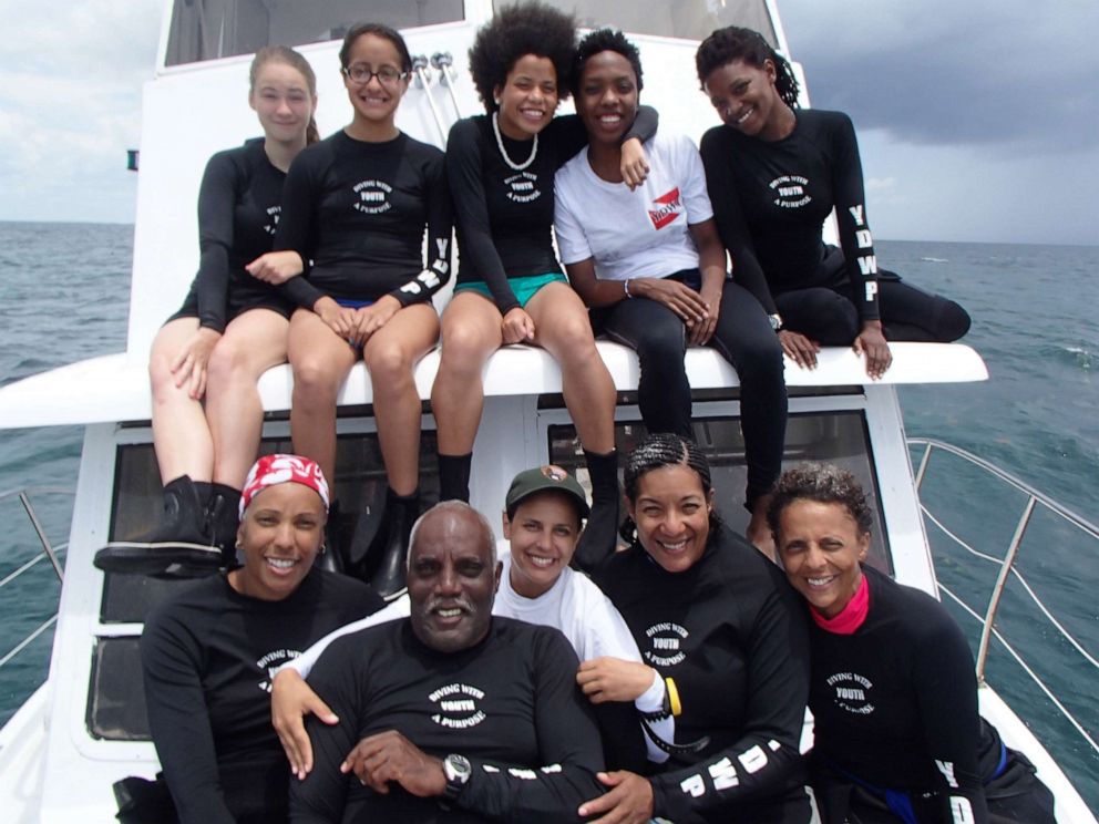 PHOTO: Members of the Diving With a Purpose scuba diving team pose for a photo.