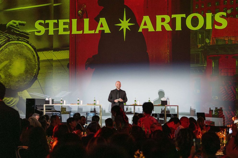 PHOTO: Sean Evans is shown on stage at the Hall des Lumières in New York for Stella Artois’ The World’s Most Fascinating Dinner, in support of Water.org, on Sept. 21, 2023, in New York.