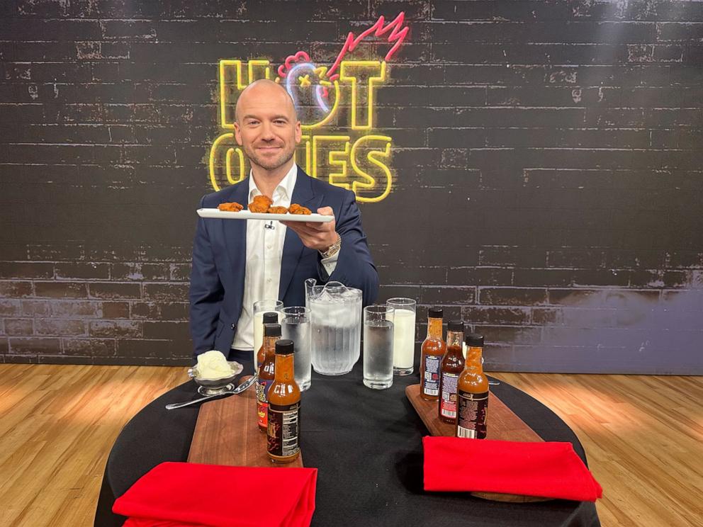 PHOTO: Hot Ones host Sean Evans holds a tray of chicken wings on "Good Morning America."