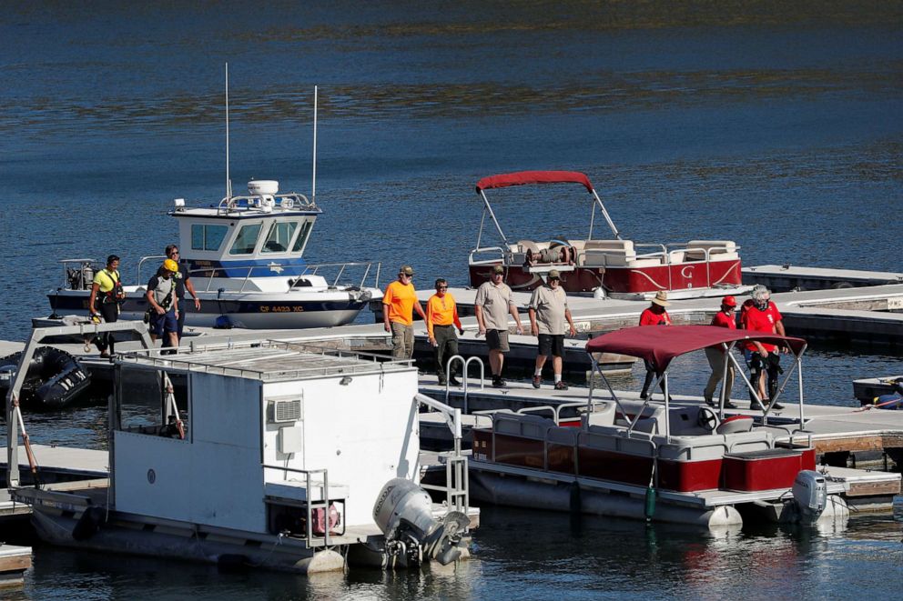 PHOTO: Members of a search and rescue team walk on a dock as authorities search for missing actor Naya Rivera on Lake Piru, Calif., July 9, 2020.