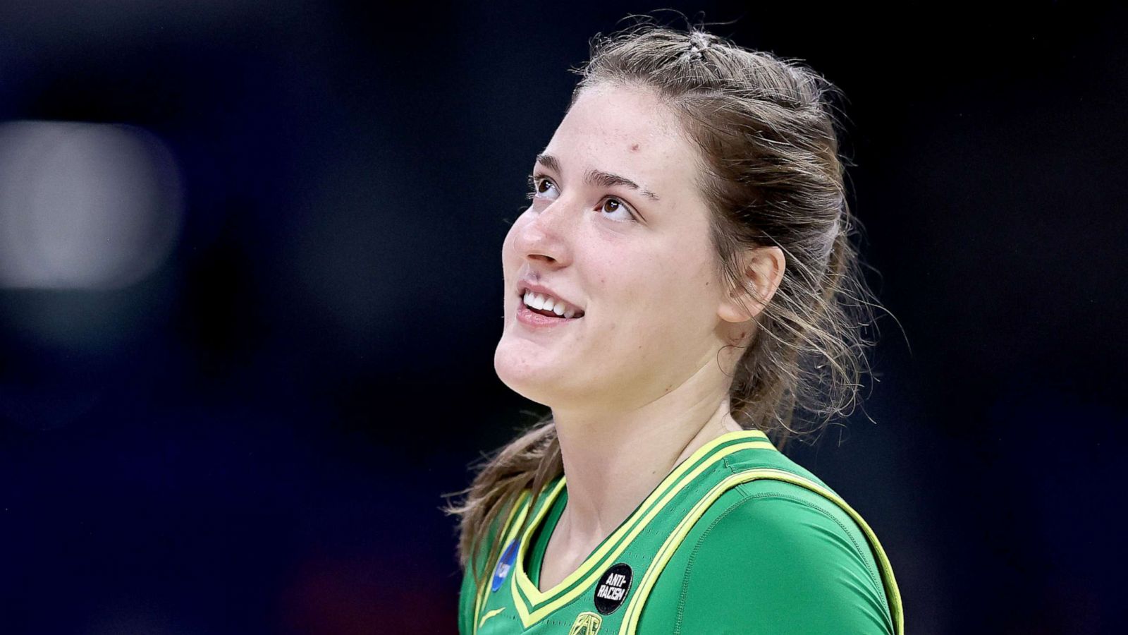 PHOTO: Sedona Prince of the Oregon Ducks smiles during player introductions before the game against the Louisville Cardinals during the Sweet Sixteen round of the NCAA Women's Basketball Tournament at the Alamodome on March 28, 2021 in San Antonio, Texas.