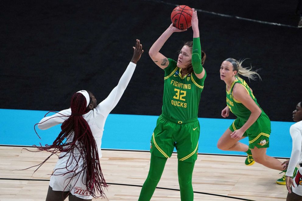 PHOTO: Oregon Ducks forward Sedona Prince shoots against Louisville Cardinals forward Olivia Cochran in the Sweet Sixteen of the 2021 Women's NCAA Tournament at Alamodome on March 28, 2021, in San Antonio, Texas.